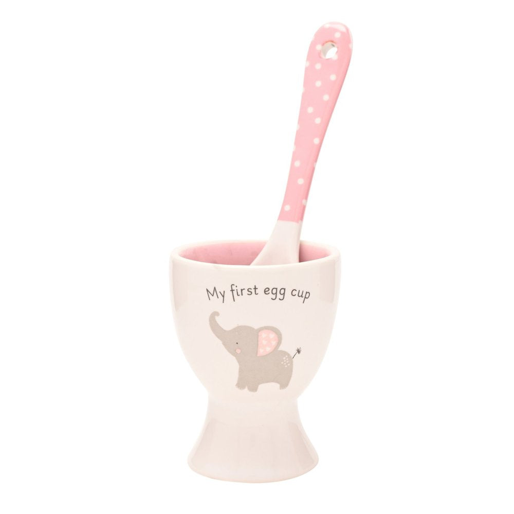 Pink egg cup with spoon featuring an elephant design on a white background