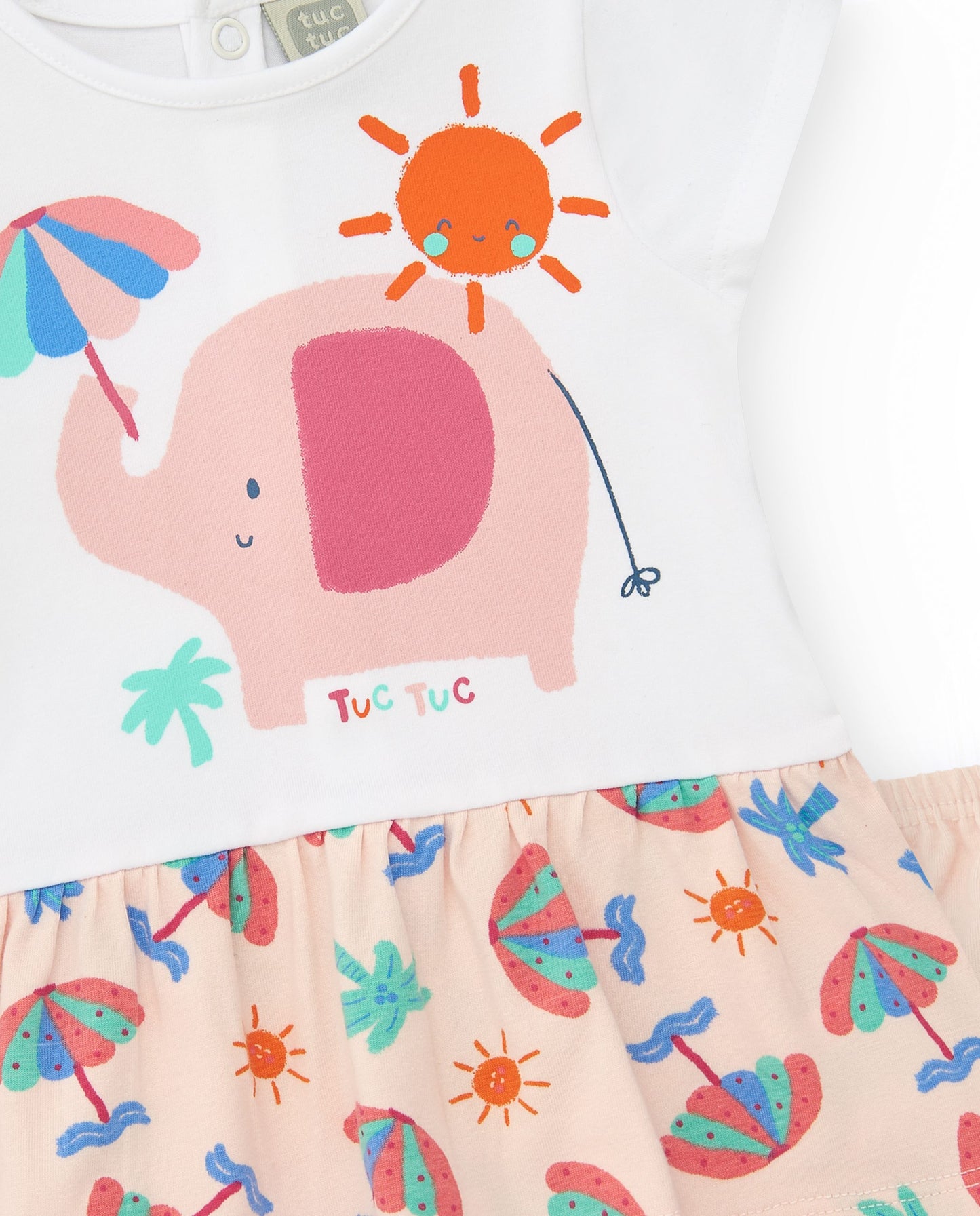 Children's dress with an elephant design and colorful patterns on a white background close up